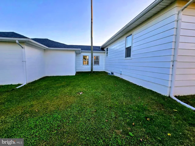 a backyard of a house with lots of green space