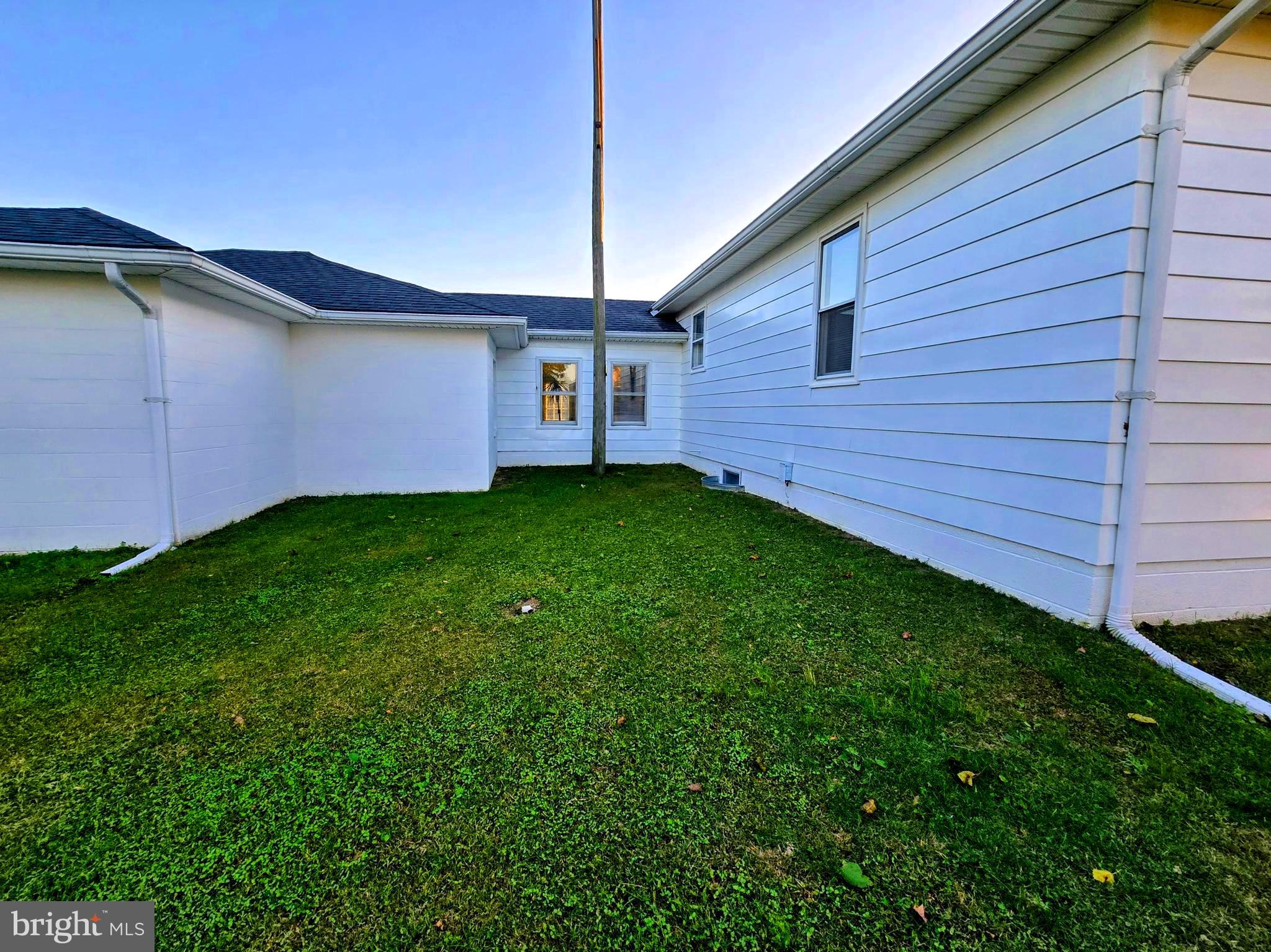 8445 North Old State Road Lincoln, DE 19960 - Photo 28 of 32 a backyard of a house with lots of green space