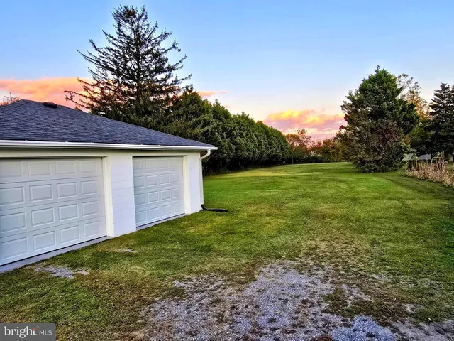 a view of a backyard with a garden
