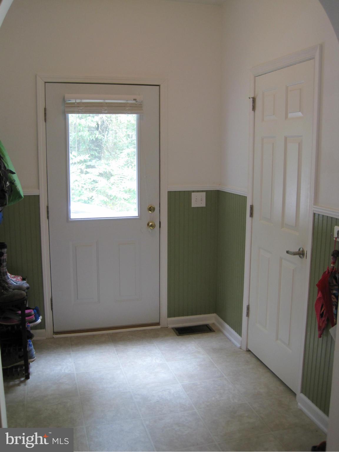 541 Stringtown Road Berryville, VA 22611 - Photo 3 of 19 an empty room with windows
