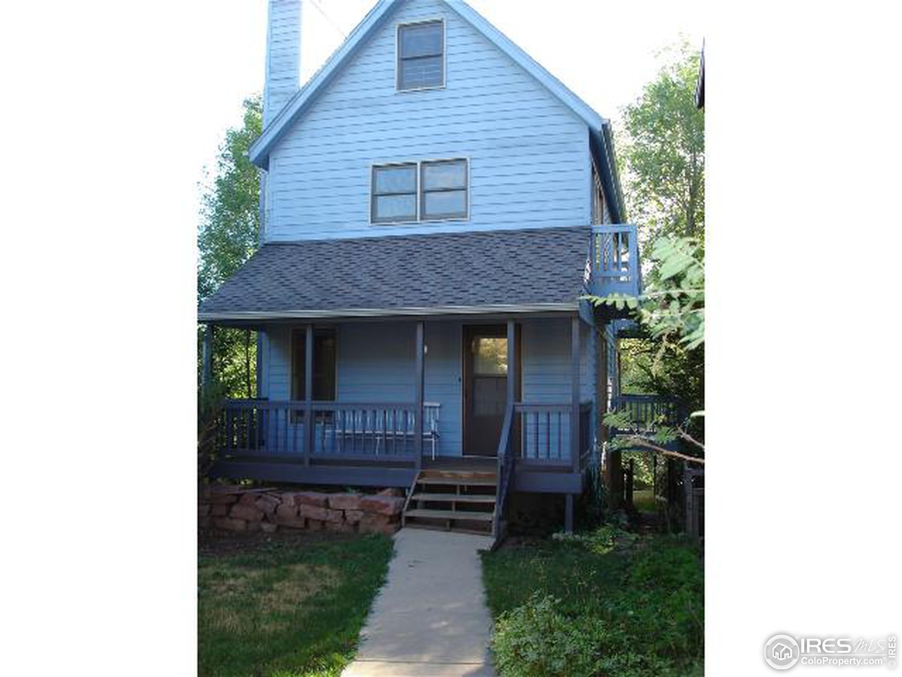 4160 Riverside Avenue Boulder, CO 80304 - Photo 2 of 17 a view of a house with brick walls and a yard with plants