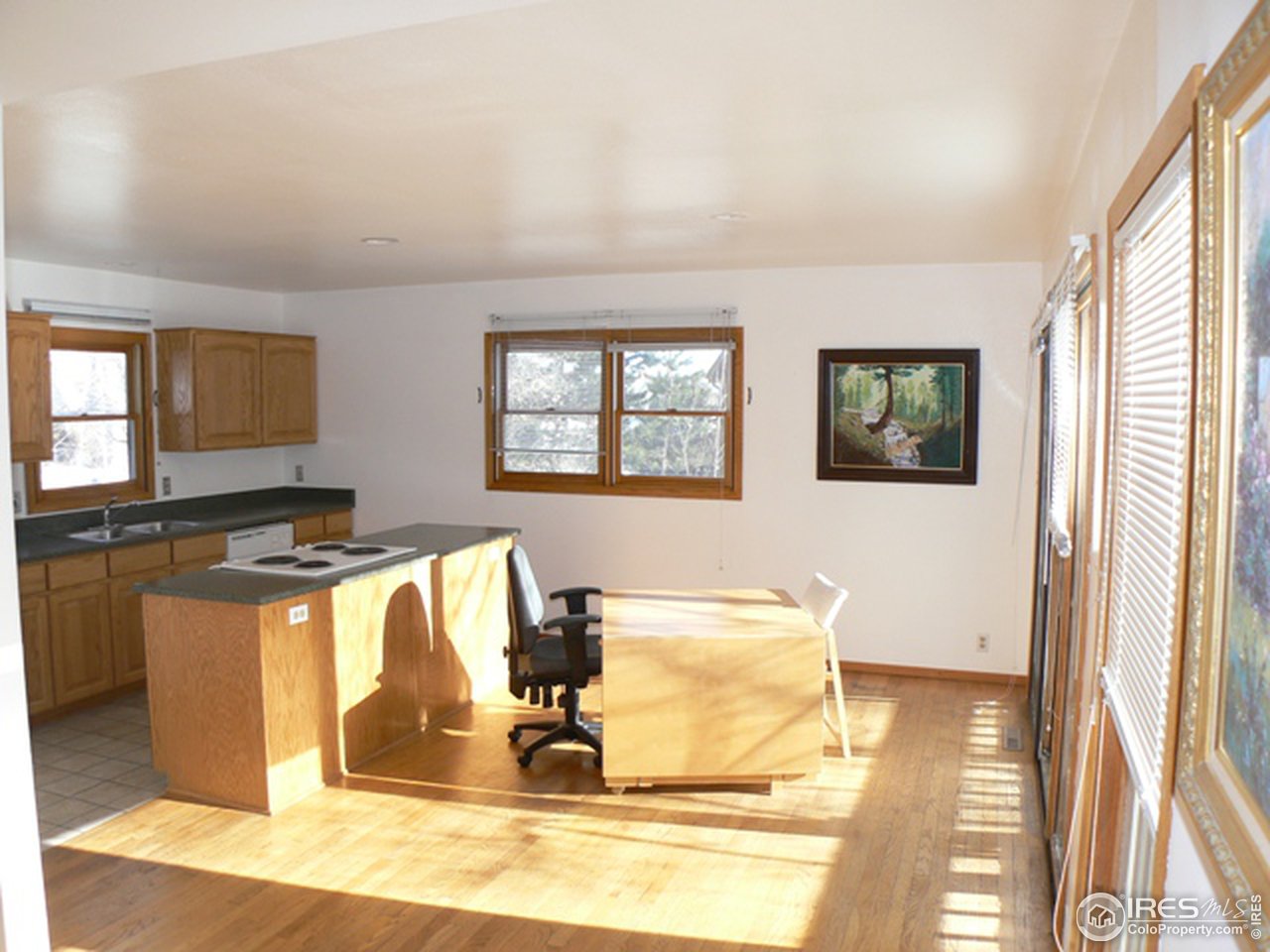 4160 Riverside Avenue Boulder, CO 80304 - Photo 5 of 17 a view of a kitchen with a sink wooden floor and a dining table