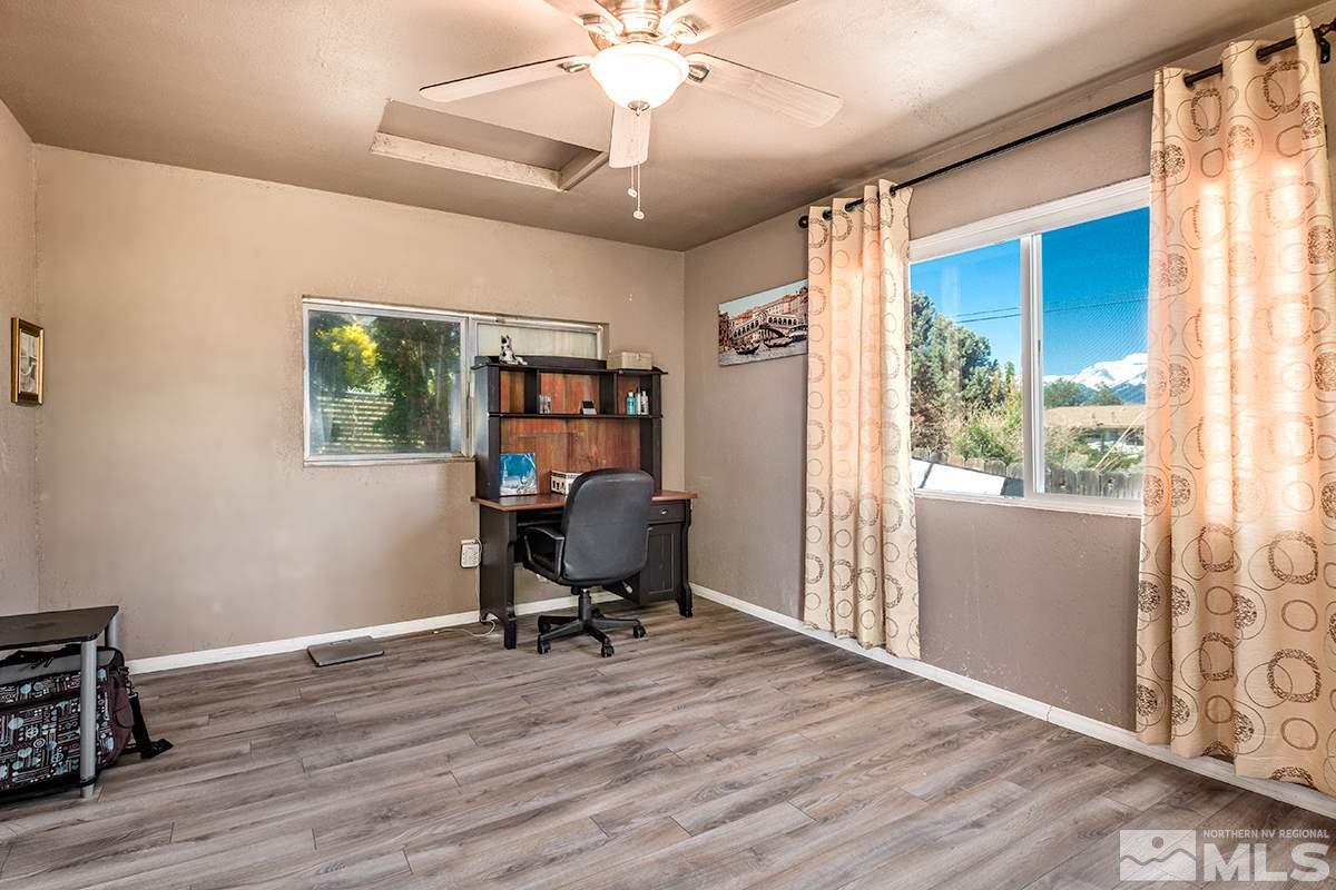 13805 Virginia Foothills Drive Reno, NV 89521 - Photo 22 of 25 a view of a workspace with furniture and a window