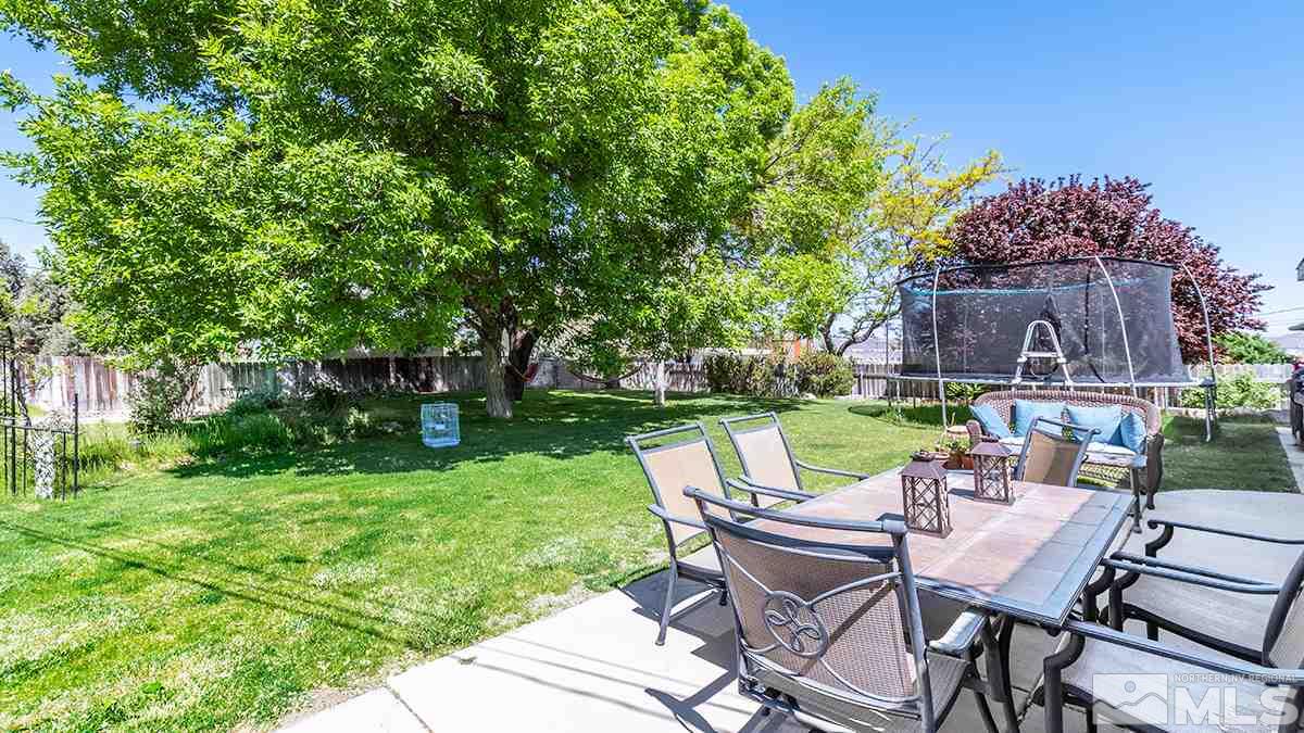 13805 Virginia Foothills Drive Reno, NV 89521 - Photo 23 of 25 a view of a chairs and table in backyard of the house