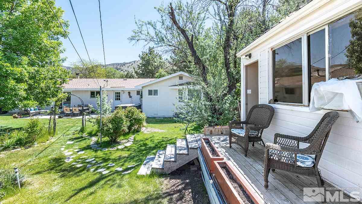 13805 Virginia Foothills Drive Reno, NV 89521 - Photo 3 of 25 a view of house with backyard outdoor seating and green space