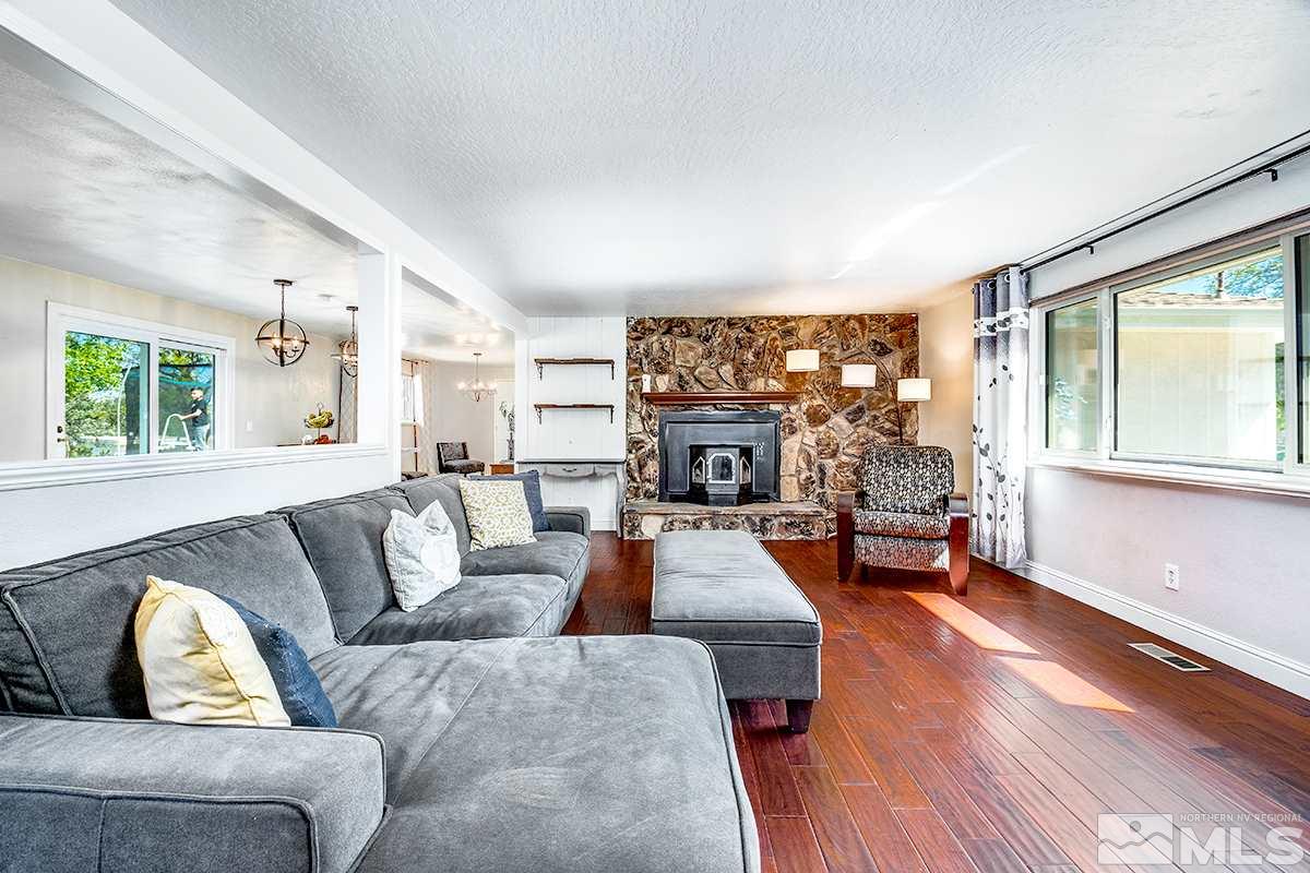 13805 Virginia Foothills Drive Reno, NV 89521 - Photo 7 of 25 a living room with furniture and a large window