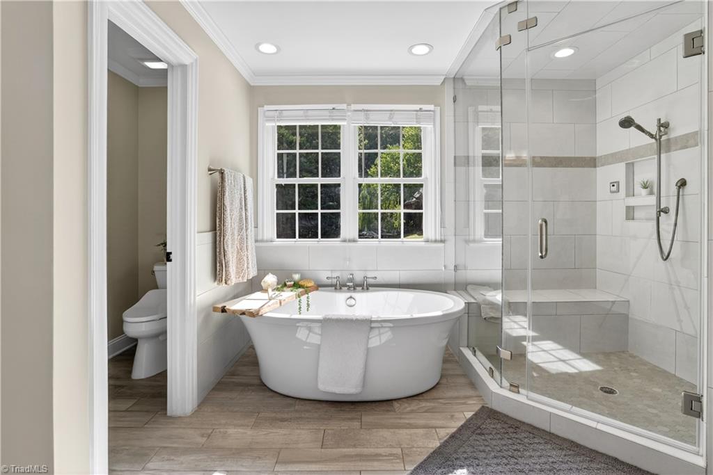 8508 Rosedale Drive Oak Ridge, NC 27310 - Photo 22 of 50 A freestanding soak that feels like a getaway.