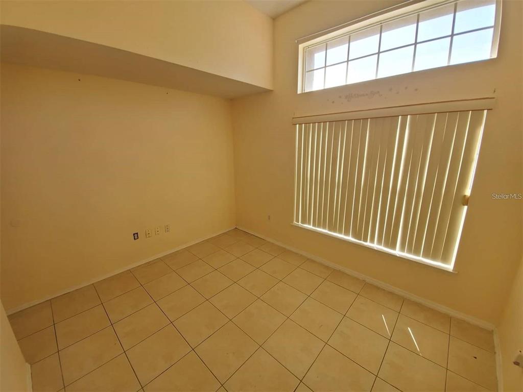 1440 Timberbend Circle Orlando, FL 32824 - Photo 12 of 20 an empty room with windows