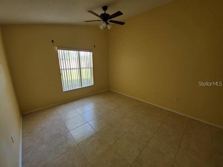 1440 Timberbend Circle Orlando, FL 32824 - Photo 14 of 20 a view of an empty room with a window
