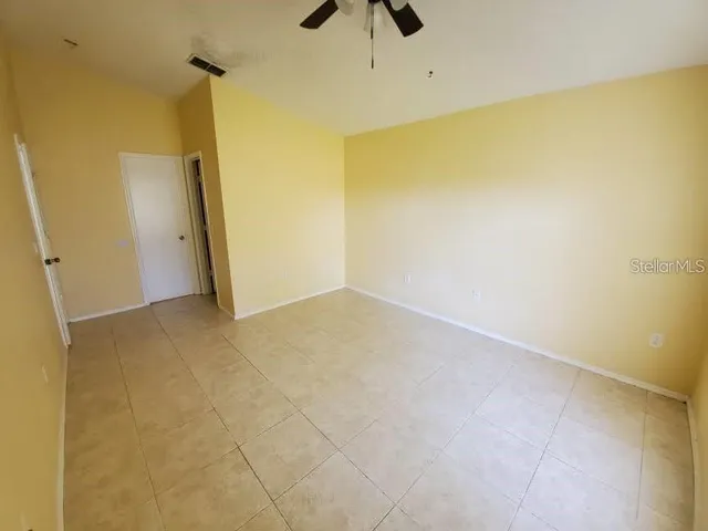a view of room with stairs and a window