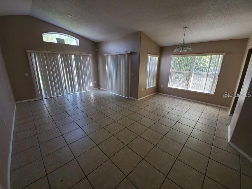 1440 Timberbend Circle Orlando, FL 32824 - Photo 18 of 20 an empty room with staircase and window