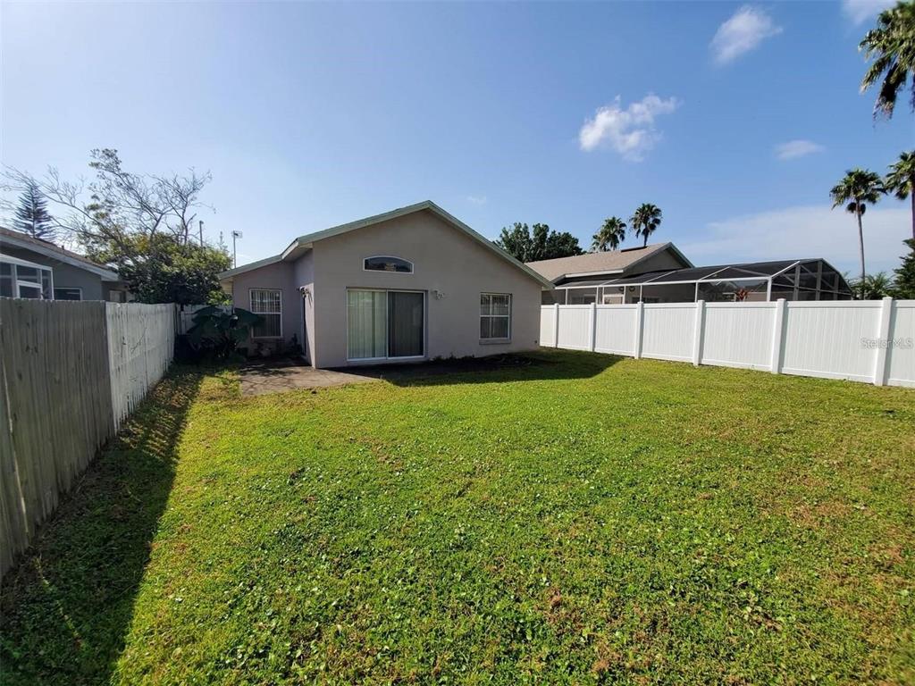1440 Timberbend Circle Orlando, FL 32824 - Photo 2 of 20 a house view with a garden space