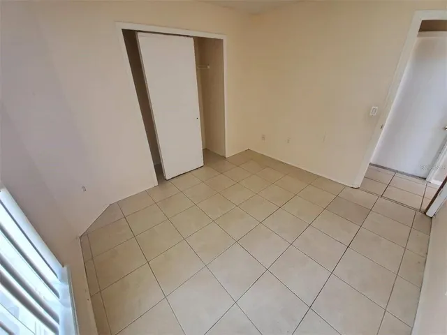 a view of an empty room with windows