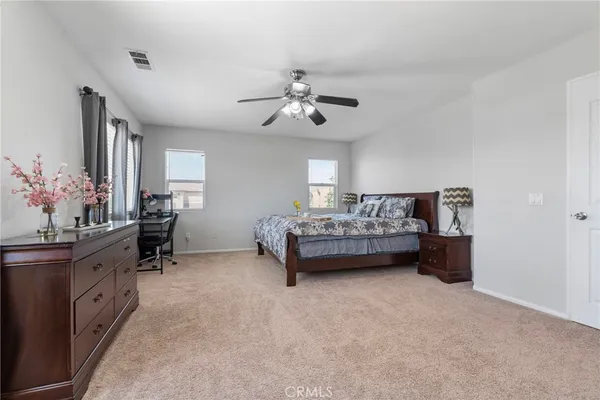 a bedroom with furniture and windows