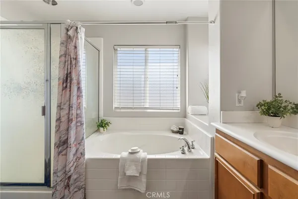 a bath room with a sink and a bath tub