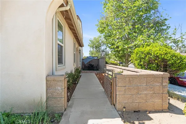 a view of a potted flower in the corridor