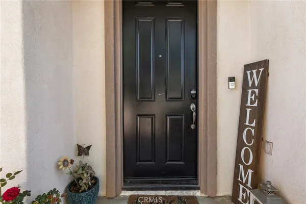 an entryway with a flower pot