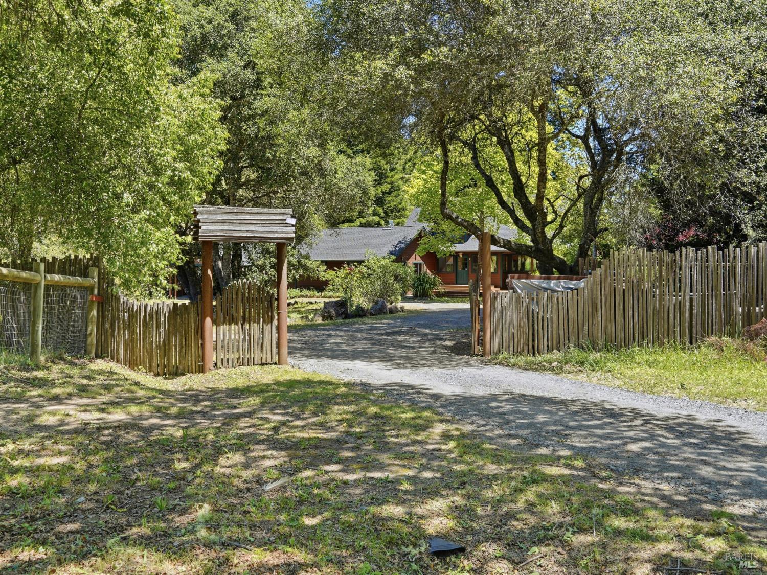 31397 Seaview Road Cazadero, CA 95421 - Photo 3 of 47 a view of a yard with wooden fence and a large tree