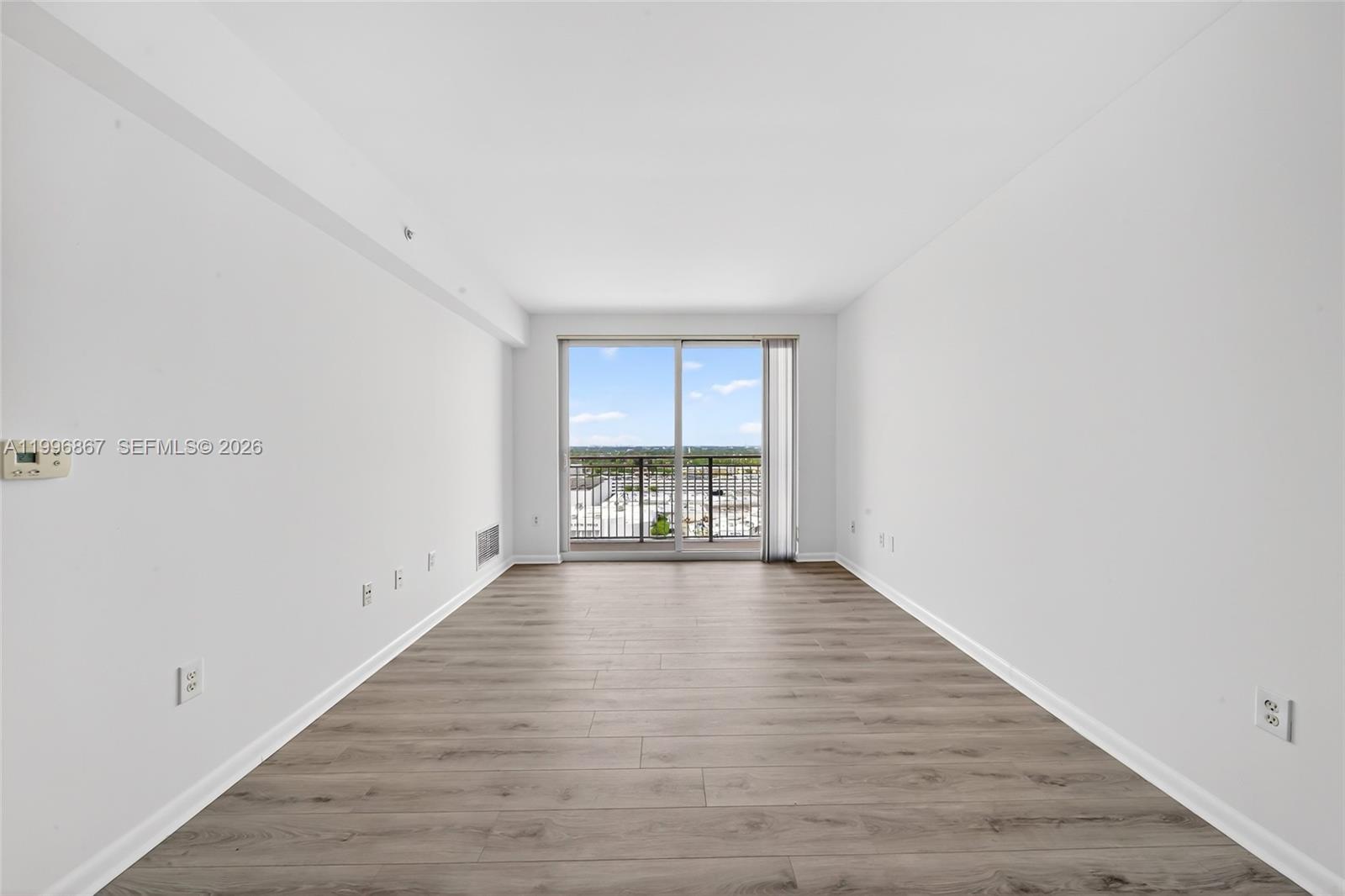 7350 Southwest 89th Street, Unit 1703S Miami, FL 33156 - Photo 12 of 29 a view of an empty room with a window