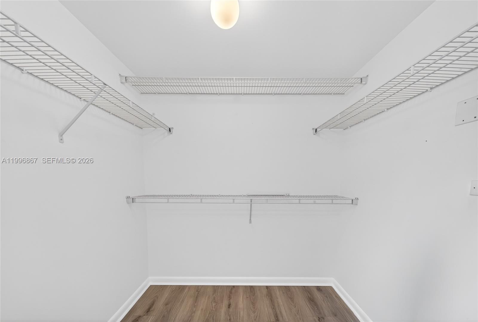 7350 Southwest 89th Street, Unit 1703S Miami, FL 33156 - Photo 17 of 29 a view of small space with racks on the wall