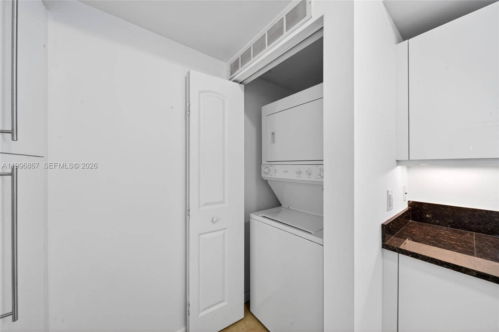 7350 Southwest 89th Street, Unit 1703S Miami, FL 33156 - Photo 24 of 29 a utility room with dryer and washer