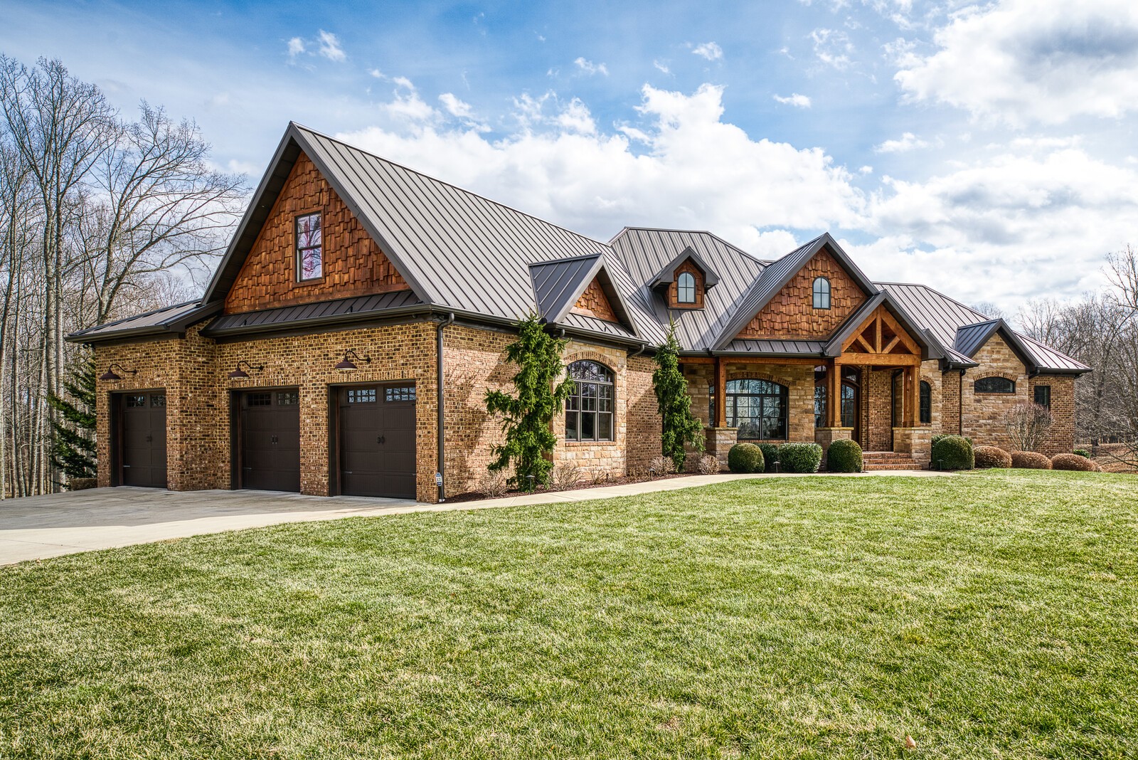 4250 Moss Road Baxter, TN 38544 - Photo 11 of 69 a front view of a house with a yard and garage