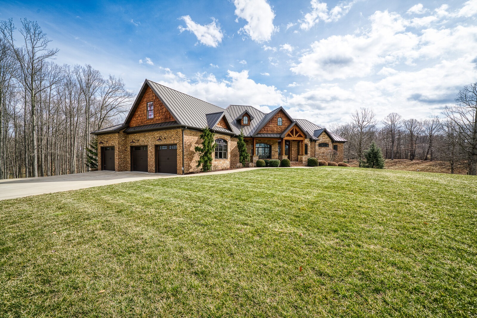 4250 Moss Road Baxter, TN 38544 - Photo 12 of 69 a view of a large house with a big yard and large trees