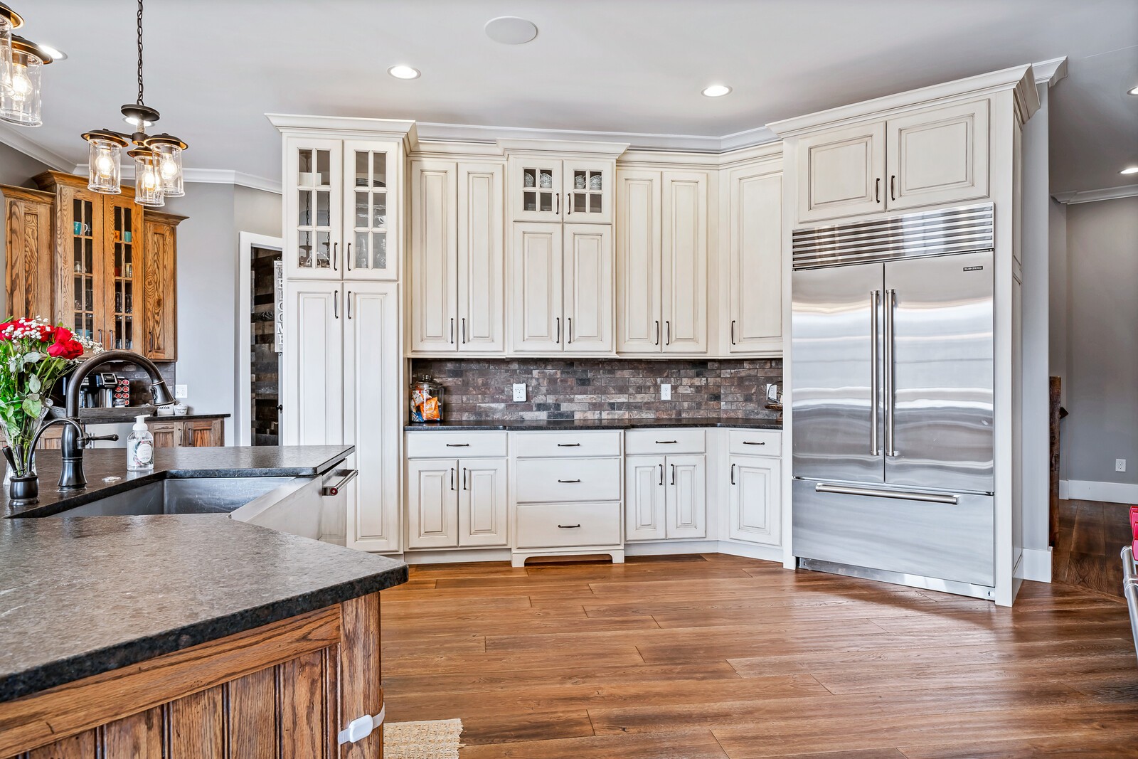 4250 Moss Road Baxter, TN 38544 - Photo 4 of 69 a kitchen with stainless steel appliances granite countertop a refrigerator and a sink