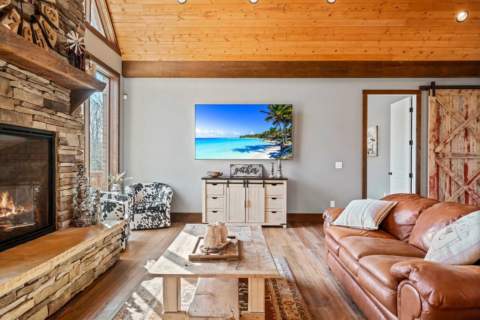 4250 Moss Road Baxter, TN 38544 - Photo 43 of 69 a living room with furniture a flat screen tv and a fireplace