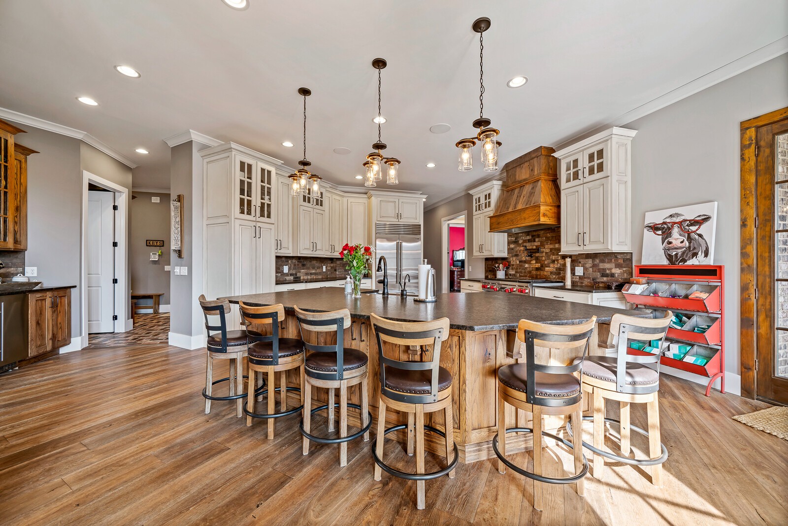 4250 Moss Road Baxter, TN 38544 - Photo 56 of 69 a view of a dining room and livingroom with furniture wooden floor kitchen view and a chandelier