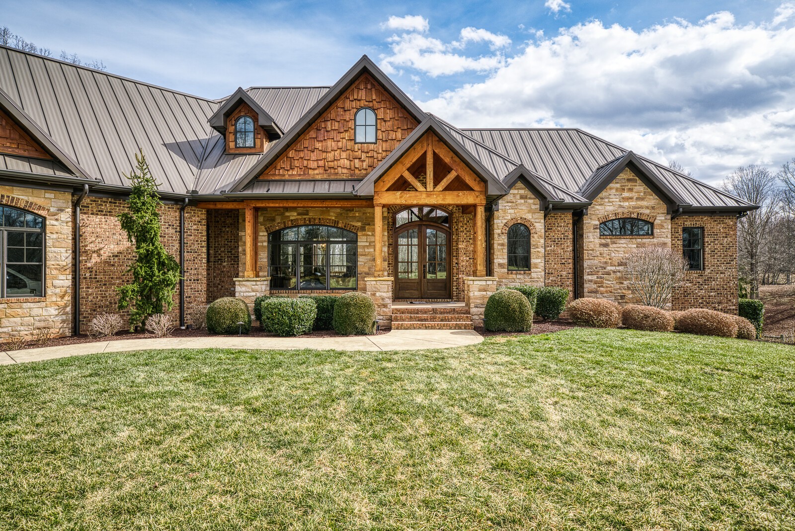 4250 Moss Road Baxter, TN 38544 - Photo 8 of 69 a front view of a house with a yard