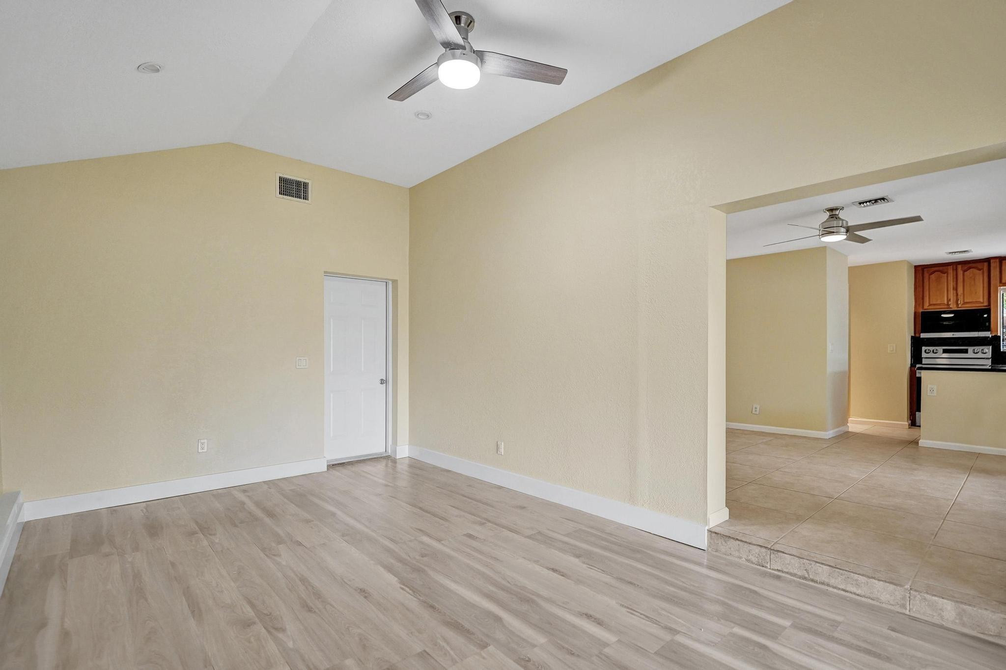 5425 Cleveland Road Delray Beach, FL 33484 - Photo 16 of 39 a view of empty room with wooden floor