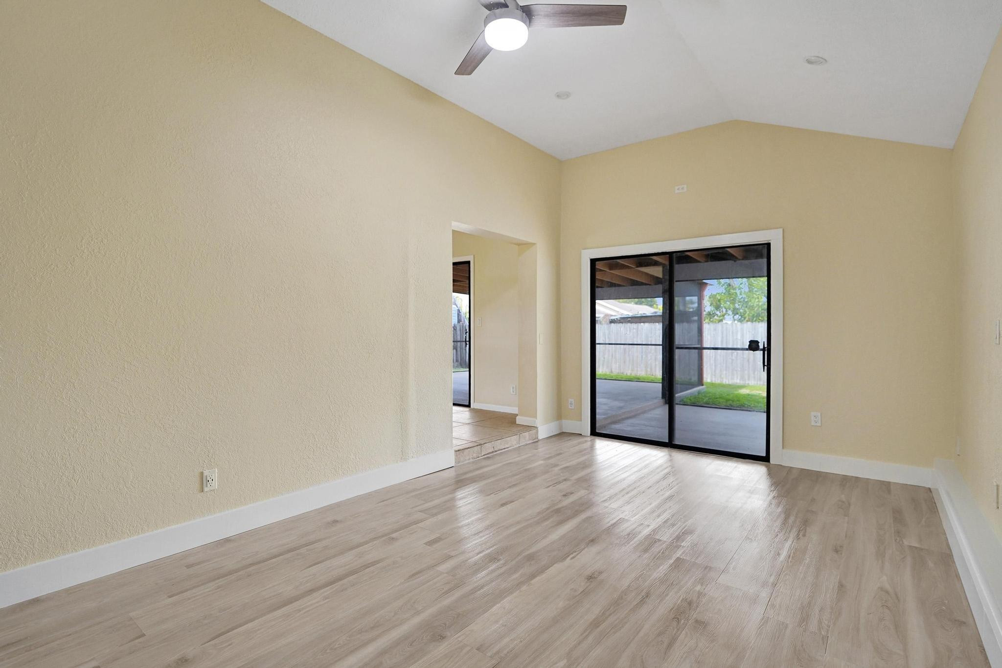5425 Cleveland Road Delray Beach, FL 33484 - Photo 17 of 39 an empty room with wooden floor and windows