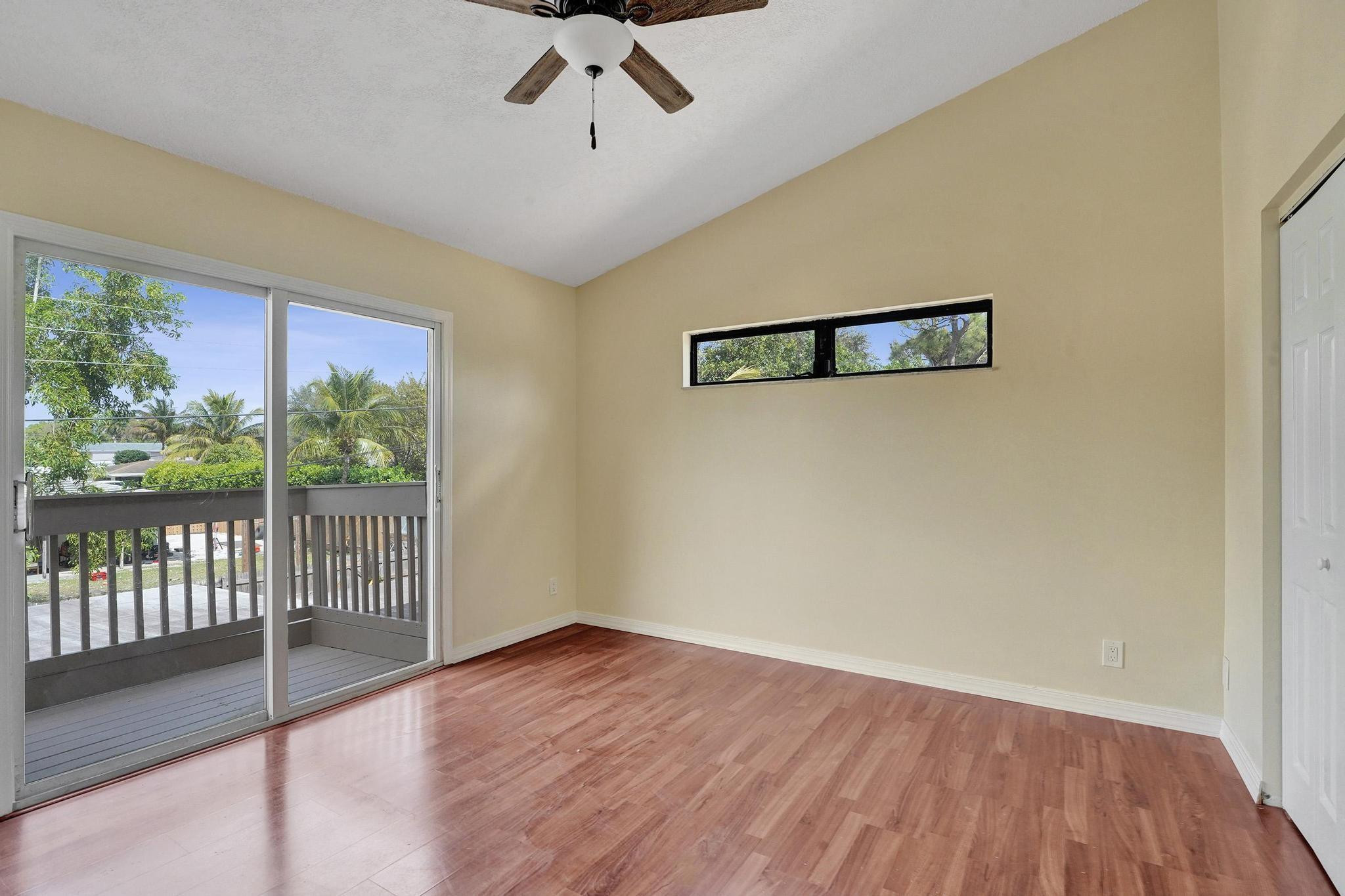 5425 Cleveland Road Delray Beach, FL 33484 - Photo 19 of 39 a view of a room with wooden floor and window