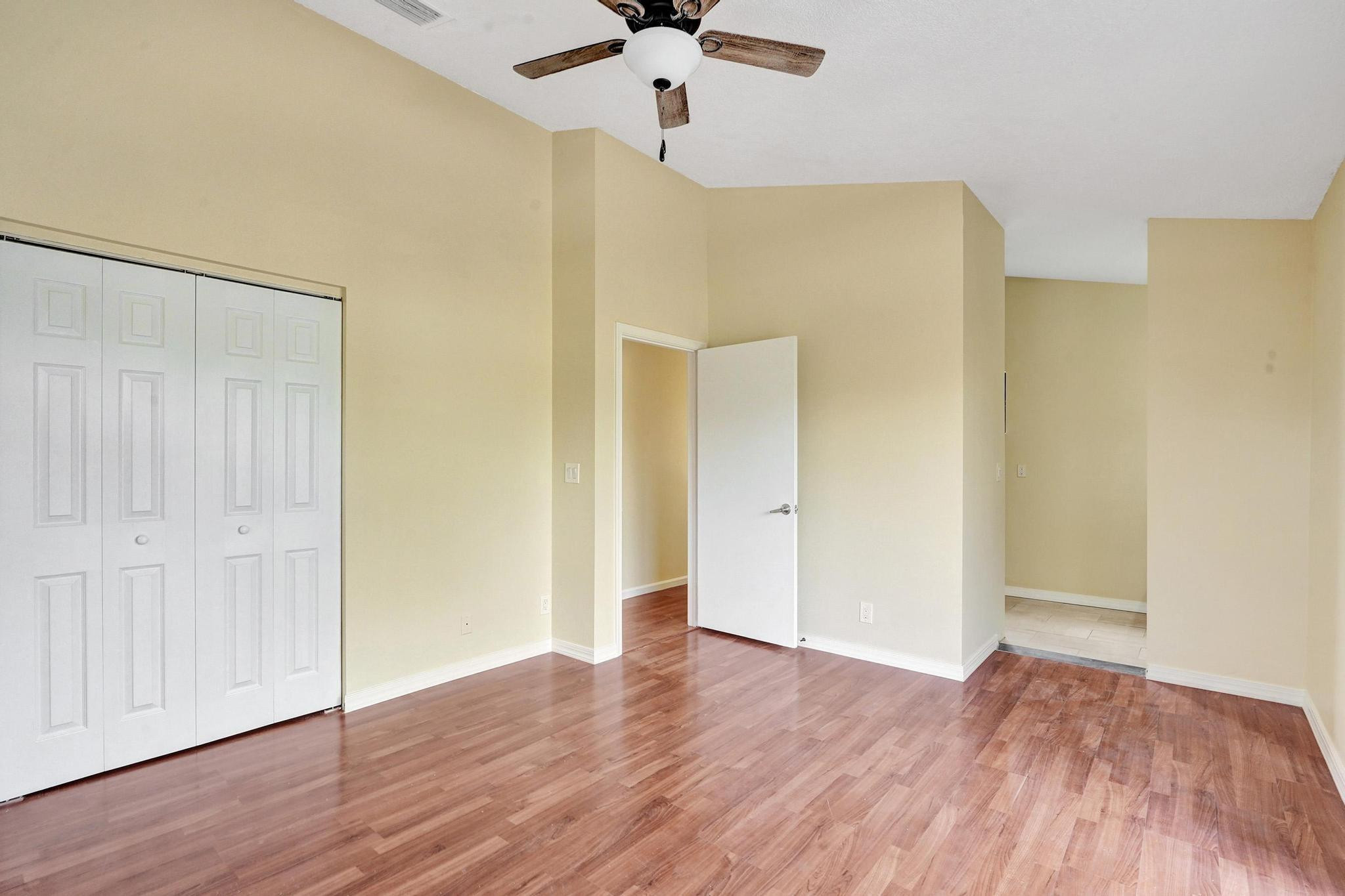 5425 Cleveland Road Delray Beach, FL 33484 - Photo 21 of 39 a view of empty room with wooden floor