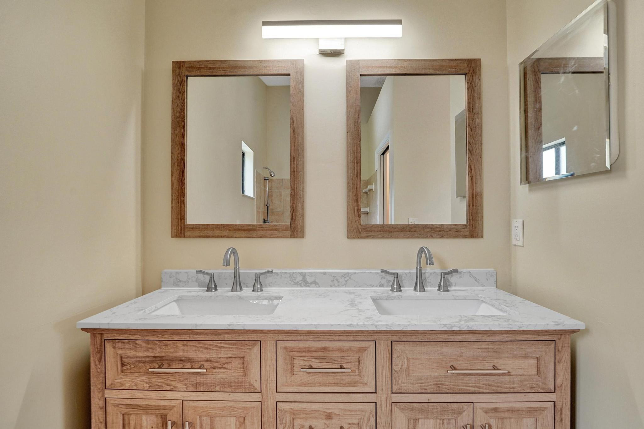 5425 Cleveland Road Delray Beach, FL 33484 - Photo 24 of 39 a bathroom with a granite countertop sink vanity and a mirror