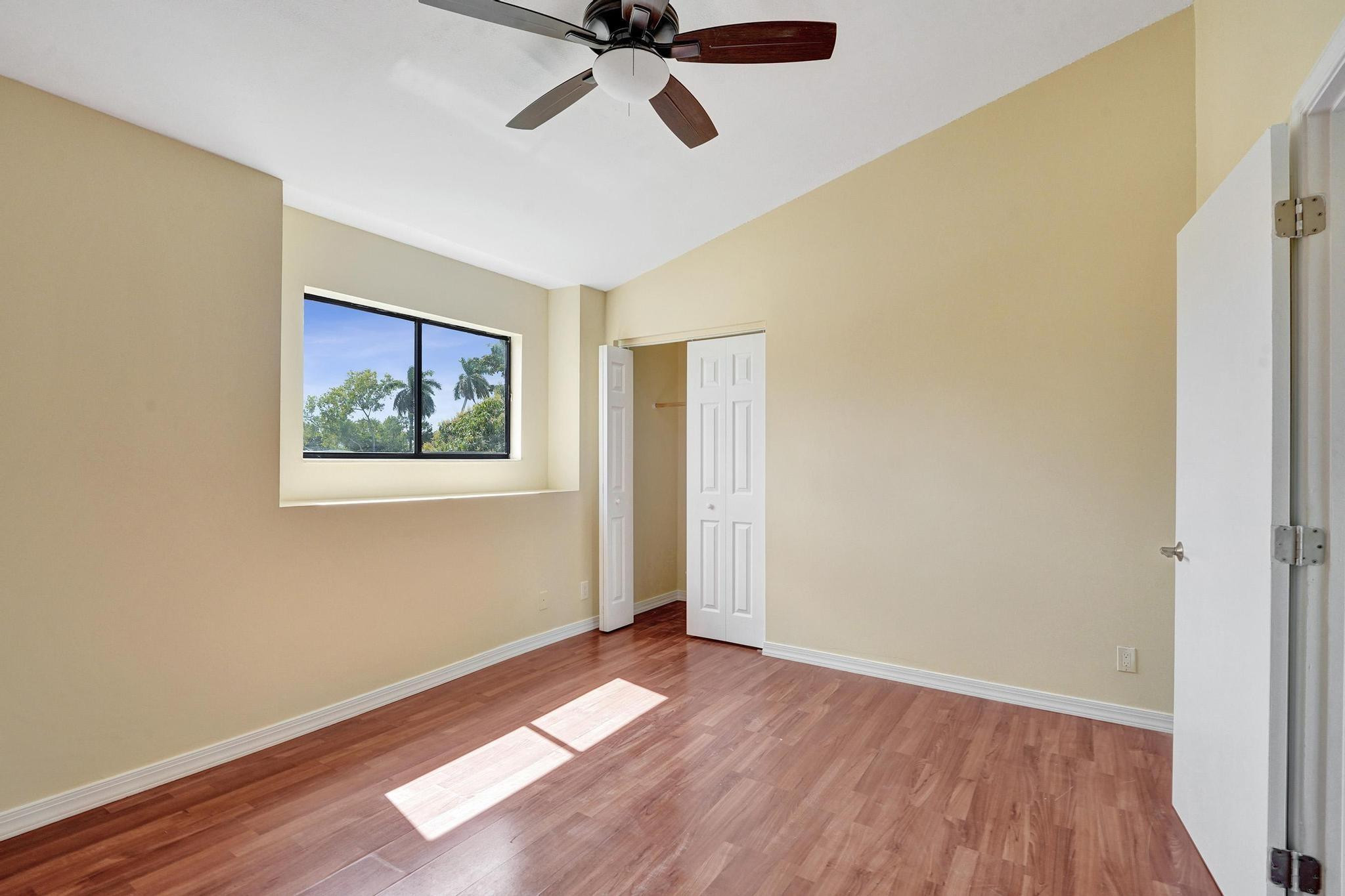 5425 Cleveland Road Delray Beach, FL 33484 - Photo 28 of 39 a view of empty room with wooden floor