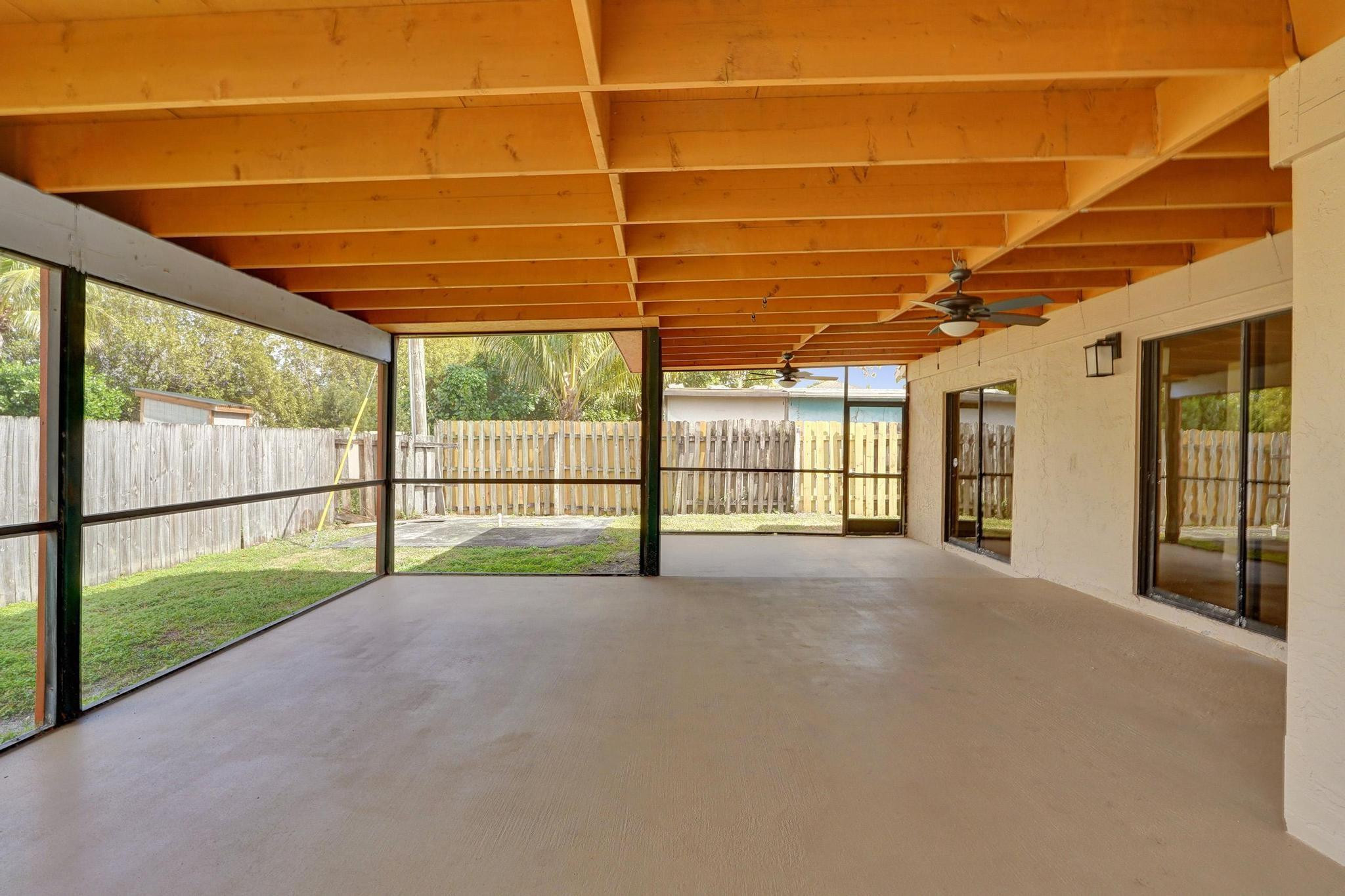5425 Cleveland Road Delray Beach, FL 33484 - Photo 35 of 39 a view of a room with wooden floor and iron stairs
