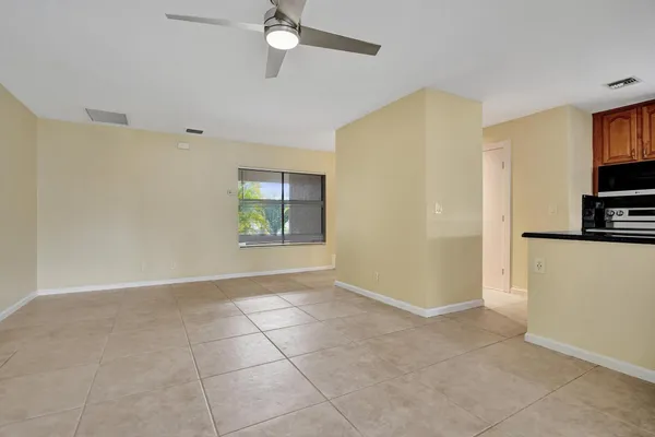 a view of an empty room with a window