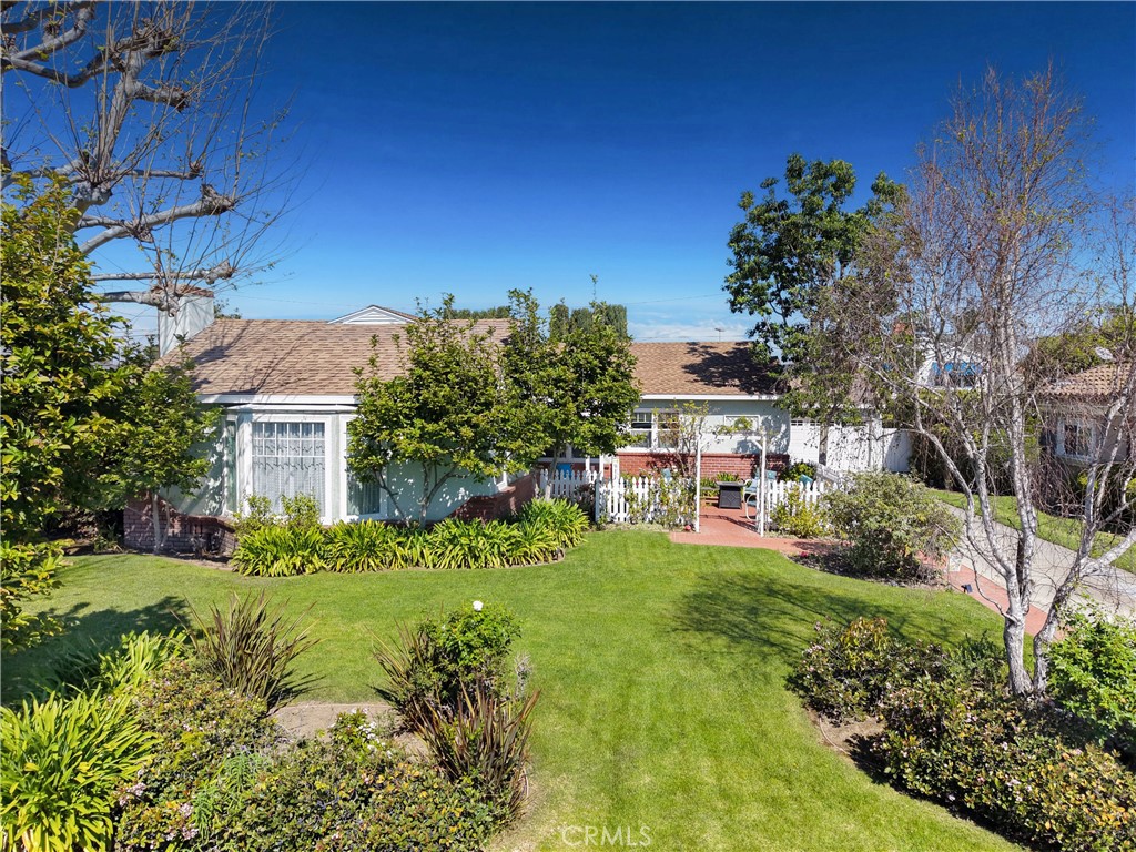 a view of house with yard