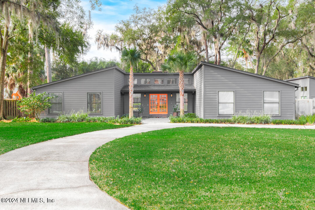 9644 Beauclerc Bluff Road Jacksonville, FL 32257 - Photo 1 of 48 a front view of house with yard and green space
