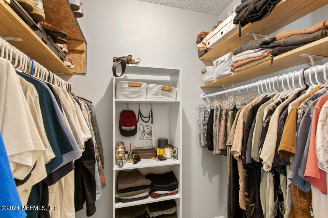 9644 Beauclerc Bluff Road Jacksonville, FL 32257 - Photo 24 of 48 a view of walk in closet with clothes and shoes