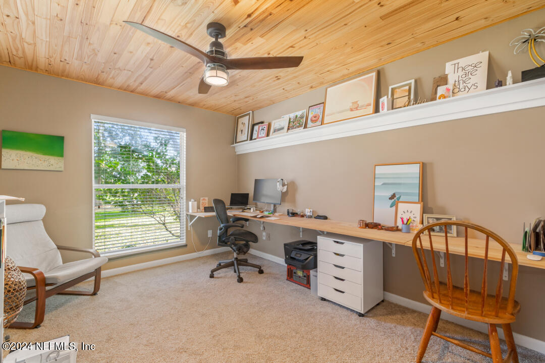 9644 Beauclerc Bluff Road Jacksonville, FL 32257 - Photo 28 of 48 a view of a workspace with furniture and a window