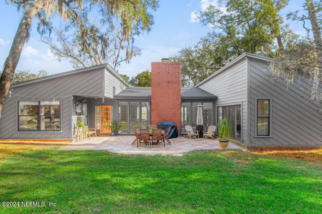 9644 Beauclerc Bluff Road Jacksonville, FL 32257 - Photo 34 of 48 a front view of house with a garden and patio