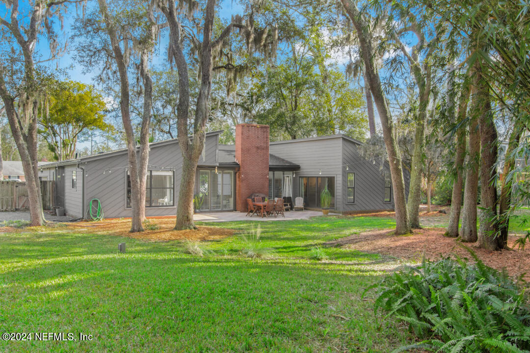 9644 Beauclerc Bluff Road Jacksonville, FL 32257 - Photo 36 of 48 a front view of a house with a yard and trees