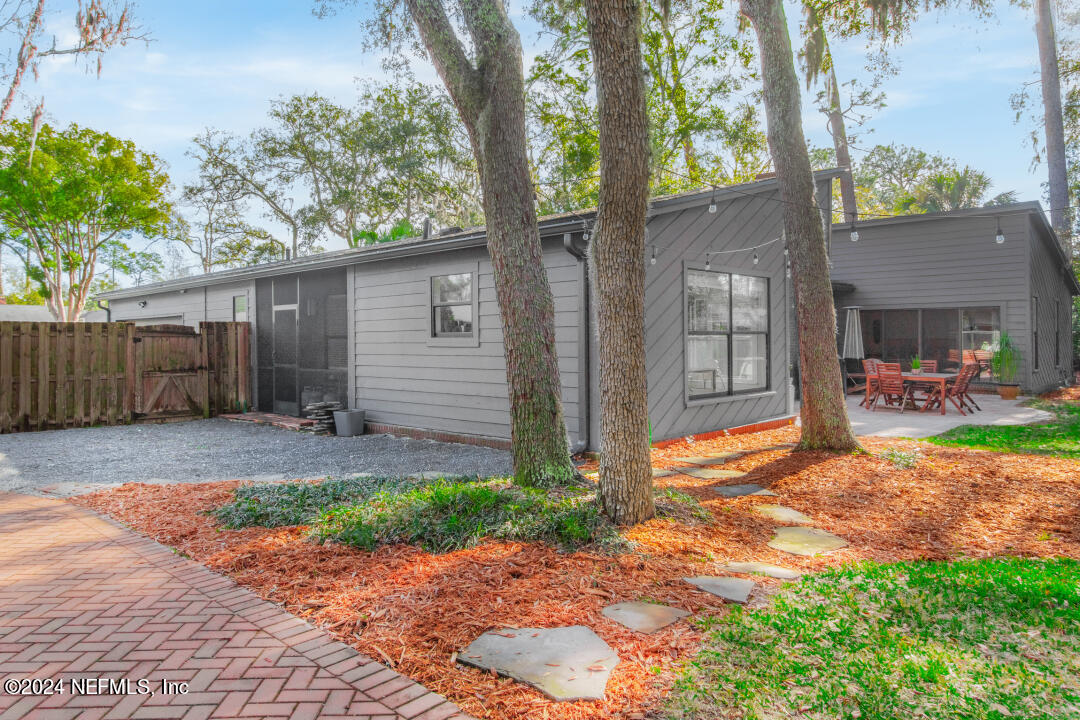 9644 Beauclerc Bluff Road Jacksonville, FL 32257 - Photo 38 of 48 a backyard of a house with seating space