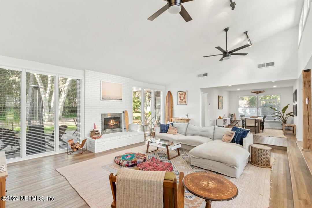 9644 Beauclerc Bluff Road Jacksonville, FL 32257 - Photo 5 of 48 a living room with furniture and a large window