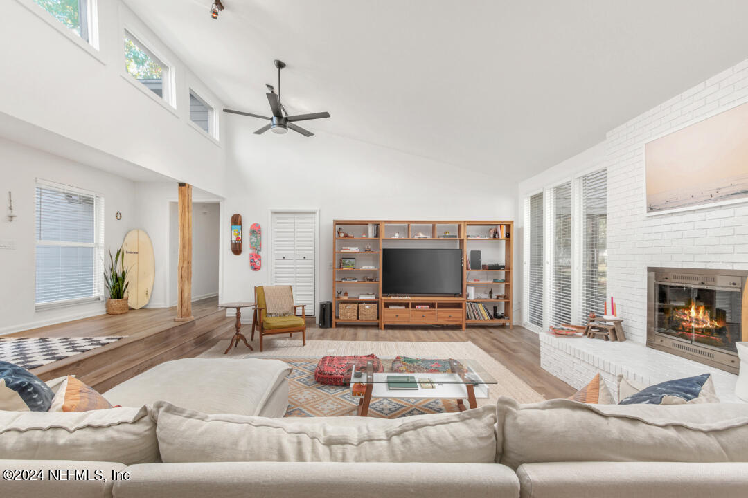 9644 Beauclerc Bluff Road Jacksonville, FL 32257 - Photo 6 of 48 a living room with furniture and a flat screen tv
