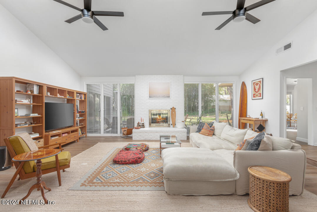 9644 Beauclerc Bluff Road Jacksonville, FL 32257 - Photo 9 of 48 a living room with furniture and a flat screen tv