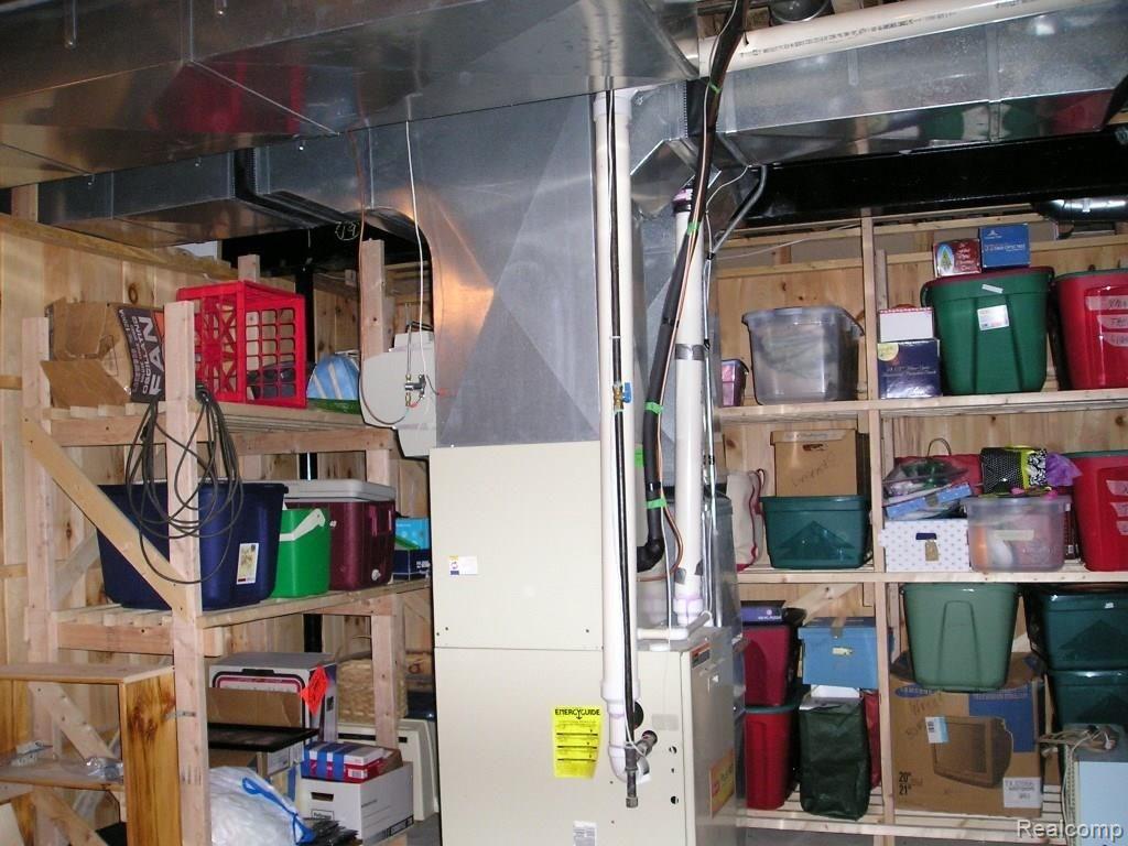 4025 Belle Ridge Drive Dryden, MI 48428 - Photo 38 of 43 Furnace room with storage shelves.